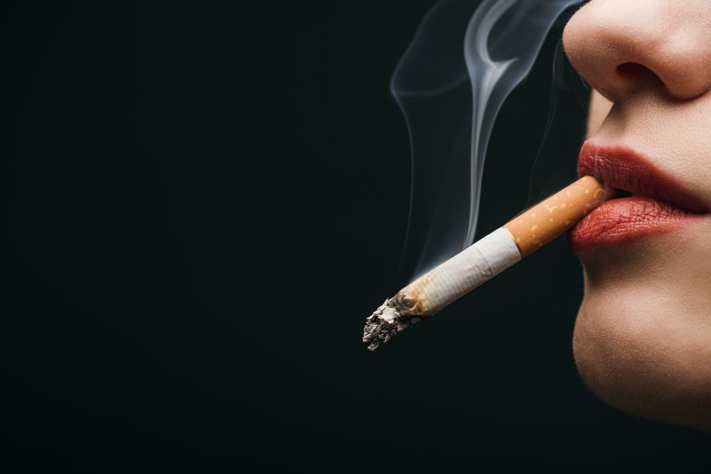 stock-photo-cropped-view-woman-smoking-cigarette.jpg